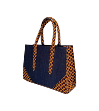 a blue and orange tote bag on a black background