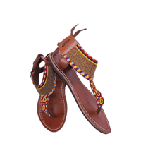 a pair of women's sandals with colorful braided straps