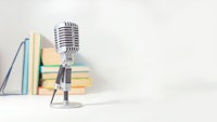 a microphone and books on a white background