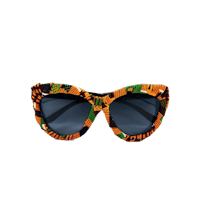 a pair of sunglasses with an african print on them